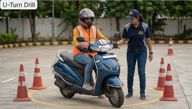 Woman practicing a scooter U-turn drill guided by an instructor at Two-Wheeler Driving Schools in Hyderabad.