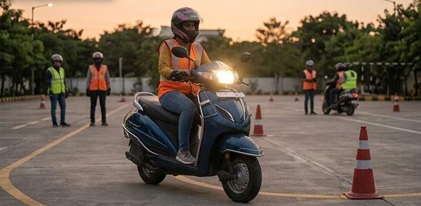 Learners practicing two-wheeler riding techniques on a dedicated track with traffic cones at Two-Wheeler Driving Schools in Hyderabad.